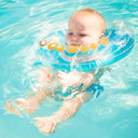 Baby floating in clear blue water with a blue inflatable ring - Baby Swimming Lessons Singapore