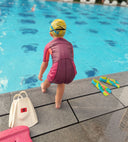 Child Standing to perform a plunge by the pool side - Dreamers Swimming lessons Singapore