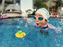 Children swimming in a pool with swim caps and goggles - Swimming Lessons with water toy - fun & structured swim class in Condominium Singapore