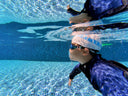 Kid Swimming Underwater holding his breath - Children Swimming Class in Singapore