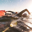 Triathlete racing in open water for Triathlon Race - Triathlon Swimming Lessons Singapore